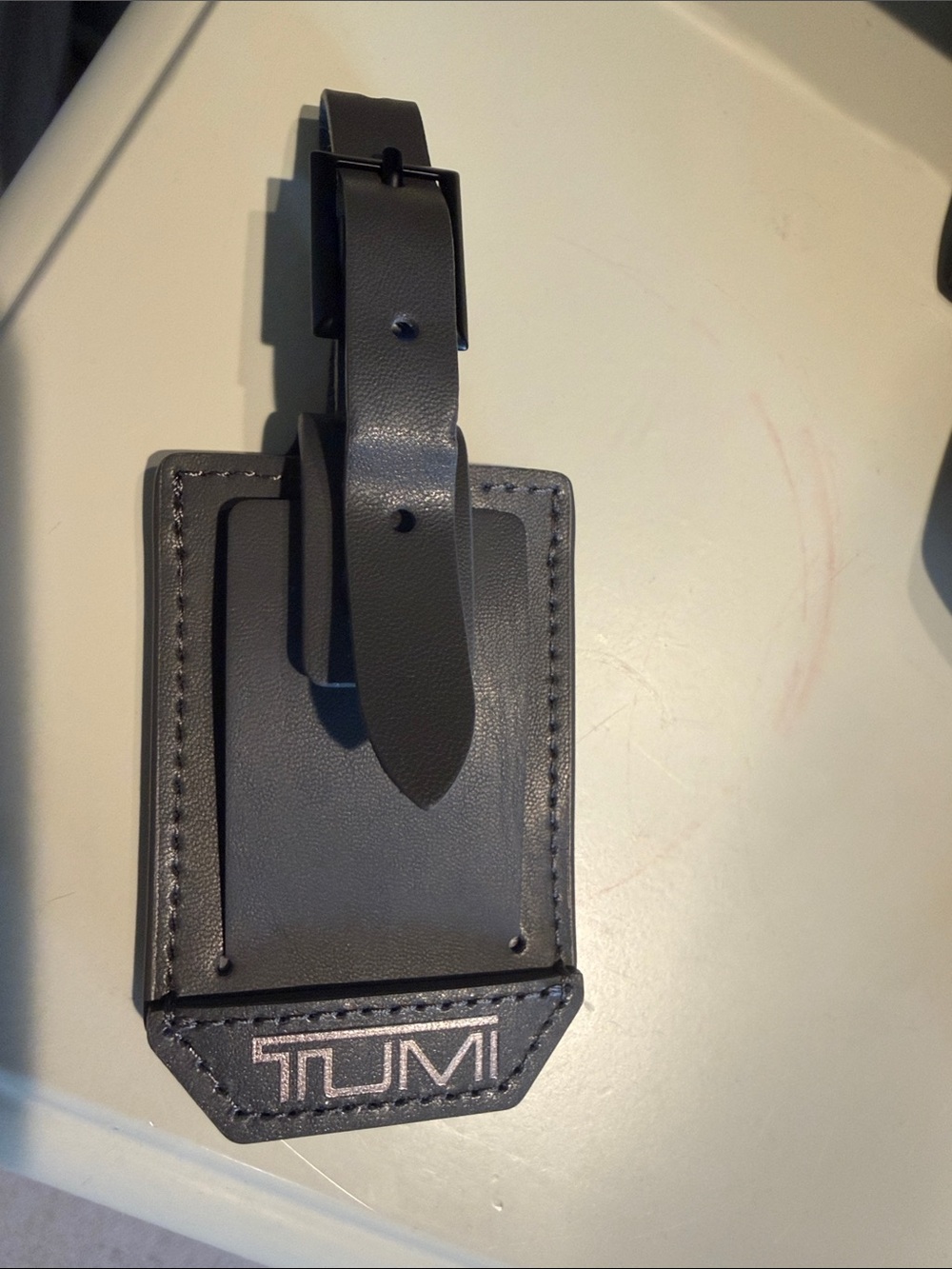 Tumi Gray Luggage Tag